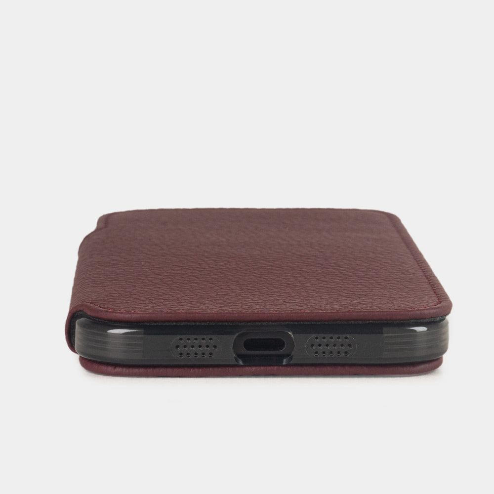 Bordeaux leather wallet case iPhone 17 - flat side view displaying ultra-thin handcrafted design, USB-C port opening and precise edge finishing