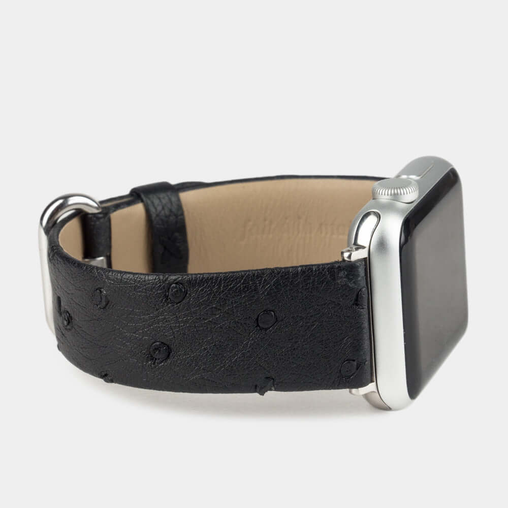 Strap for the Apple Watch 41/42 mm in black ostrich leather, with steel adapters and buckle | 3/4 profile view to see the inner lining leather
