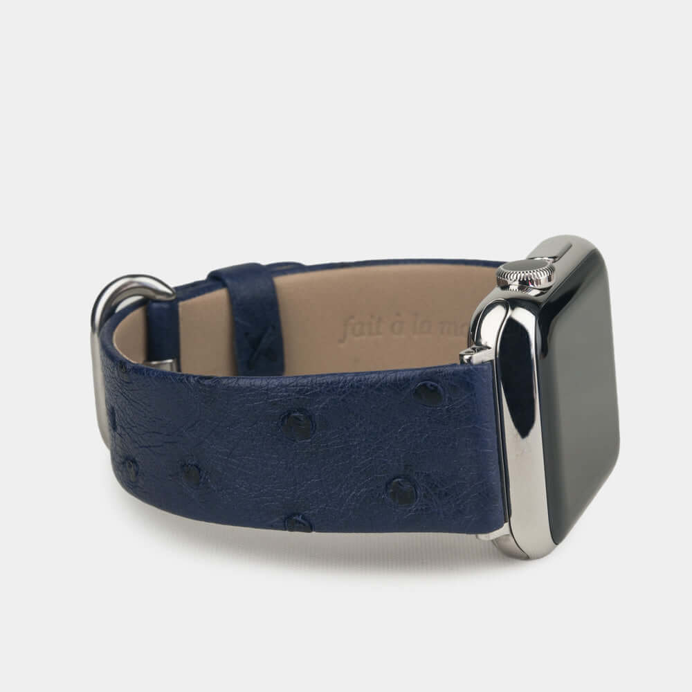 Strap for the Apple Watch 41/42 mm in blue ostrich leather, with steel adapters and buckle | 3/4 profile view to see the inner lining leather