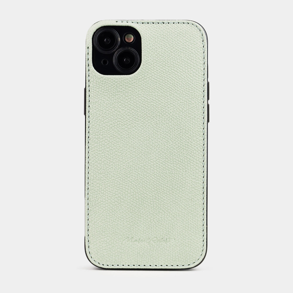 Pastel green calfskin leather cover case for iPhone 15 Plus – back view from the camera side, raised leather edge protecting the lenses