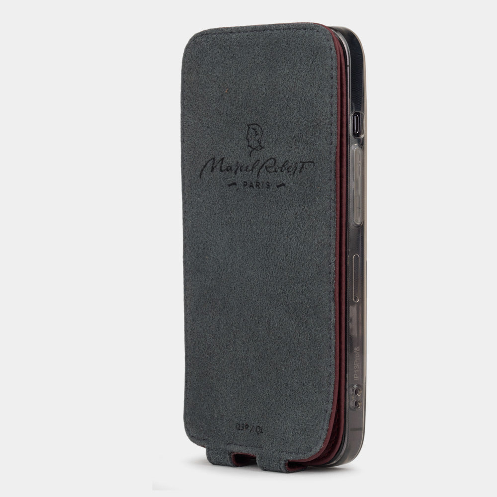 iPhone 14 Pro flip case made with bordeaux premium leather – flap folded onto the back of the iPhone, showing the Alcantara® fabric lining that cleans the screen