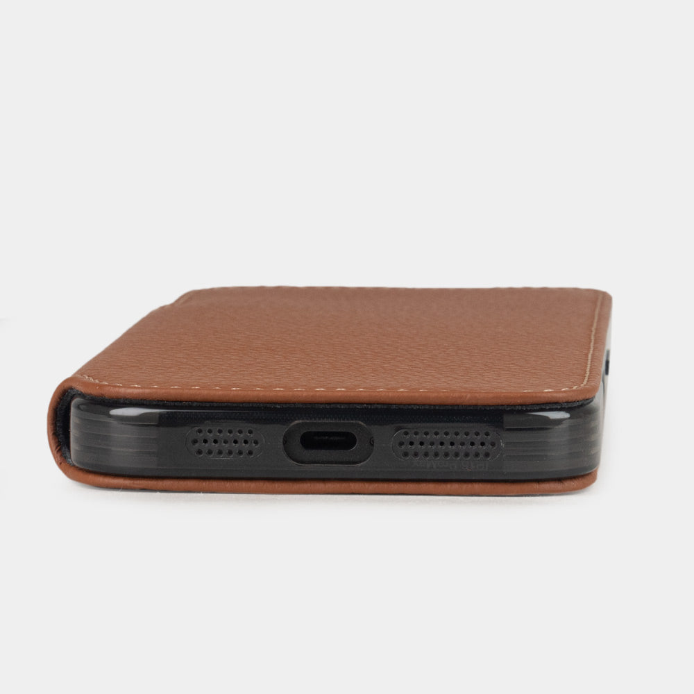 Bottom view of Marcel Robert iPhone 17 folio case in gold calfskin leather, showing USB-C port and speaker cutouts