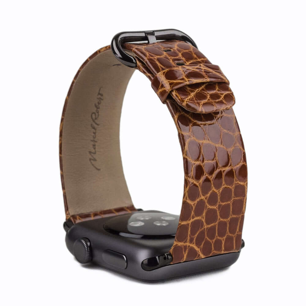 Strap for the Apple Watch 45/46 mm in Gold shiny alligator leather, with black adapters and buckle | full profile view to see the thickness of the strap