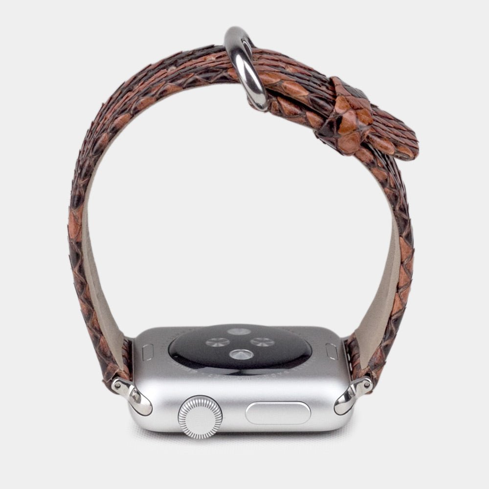gold python strap apple watch with steel adapters and buckle profile view