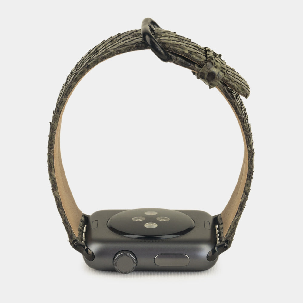 green python strap apple watch with black adapters and buckle profile view