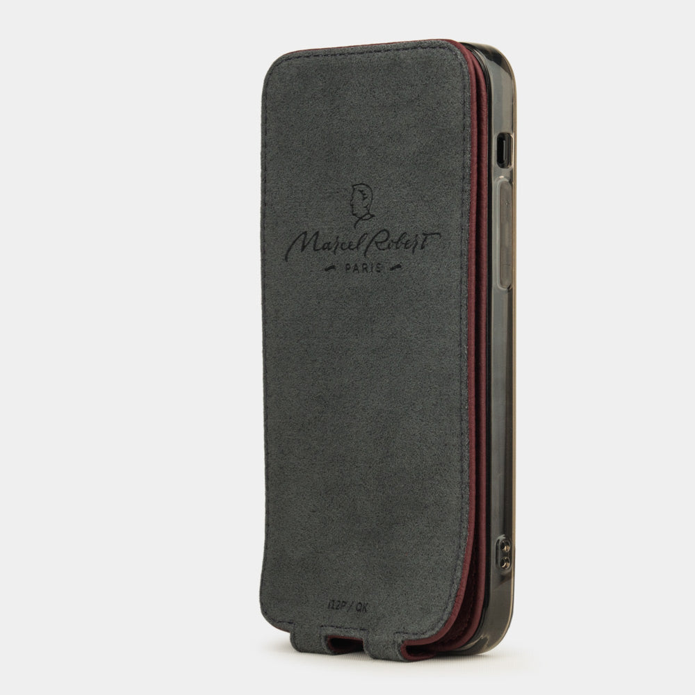 bordeaux leather flip case for iPhone 12 mini, vertical position, cover folded and secured to the back of the iPhone thanks to its integrated magnet system, revealing the grey microfibre lining