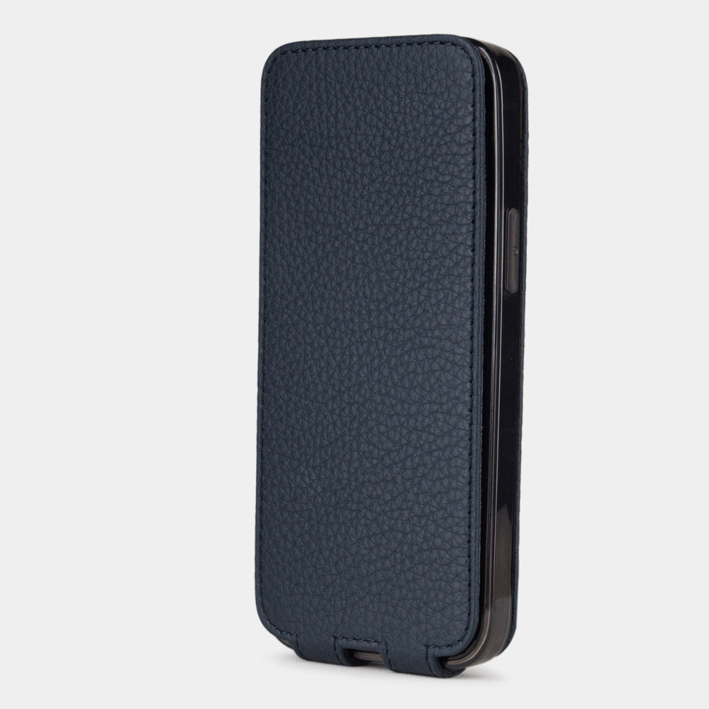 blue leather iphone 12 mini flip case in an upright position, cover closes securely thanks to its integrated magnet system