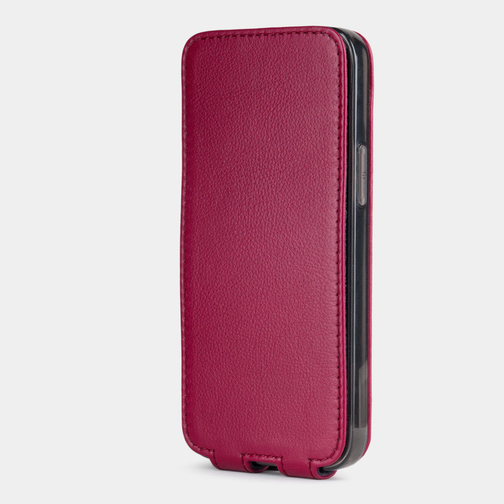 pink fushia leather iphone 12 mini flip case in an upright position, cover closes securely thanks to its integrated magnet system
