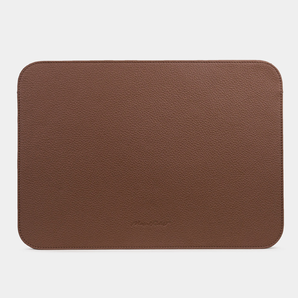 Slim brown leather laptop sleeve 14 inch holding MacBook, minimalist protective laptop case