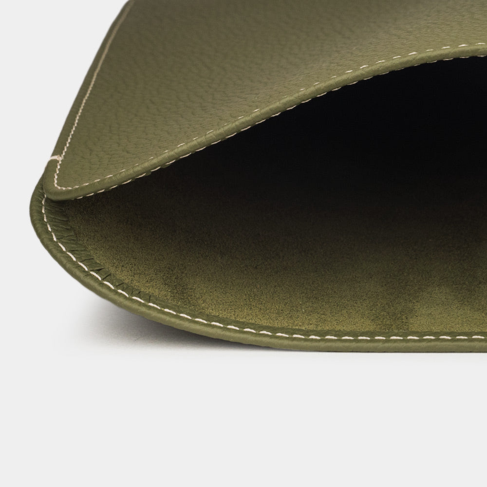 Green leather laptop sleeve 14 inch detail showing opening and soft interior lining