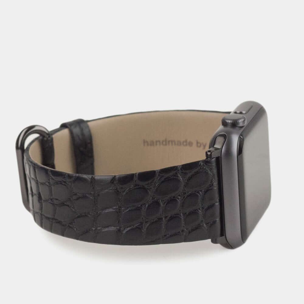 Strap for the Apple Watch 45/46 mm in black matte alligator leather, with black adapters and buckle | 3/4 profile view to see the inner lining leather