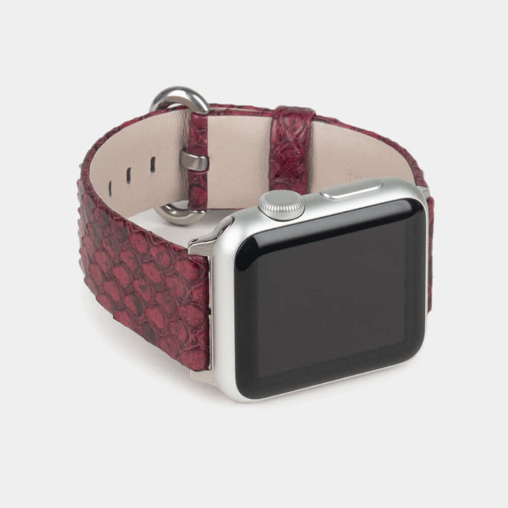 Strap for the Apple Watch 41/42 mm in bordeaux python leather, with steel adapters and buckle | 3/4 profile view to see the inner lining leather