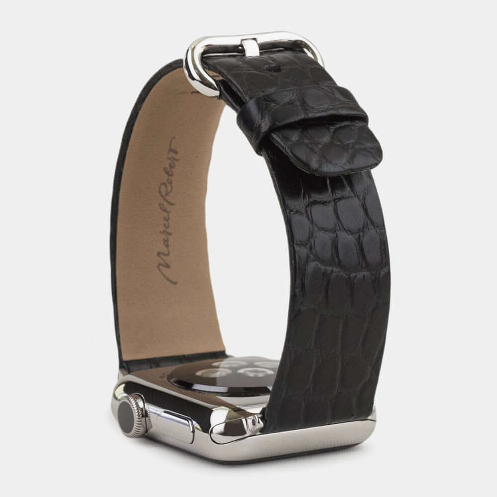 Strap for the Apple Watch 45/46 mm in black matte alligator leather, with steel adapters and buckle | 3/4 profile view to see the inner lining leather