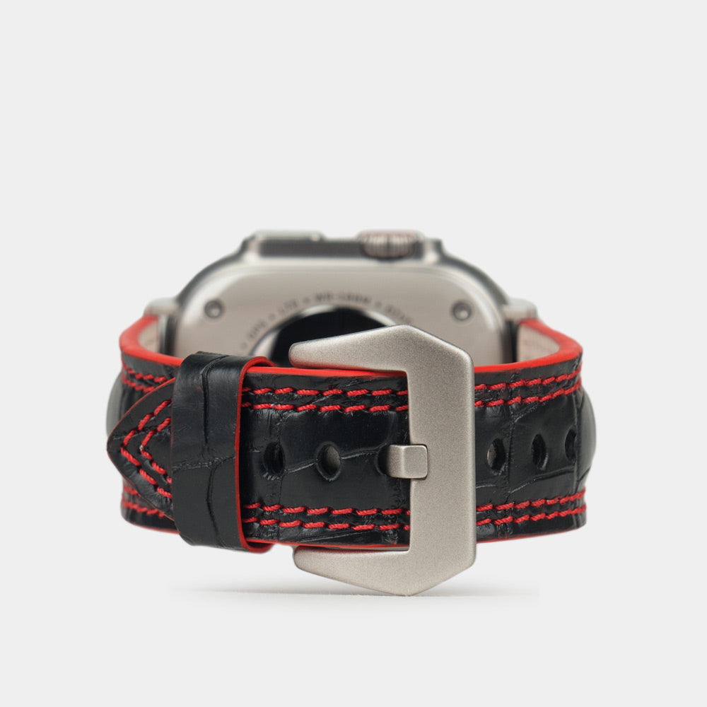 Apple Watch Ultra 49 mm in black alligator leather with red stitching and edge, with titanium adapters and buckle | main image