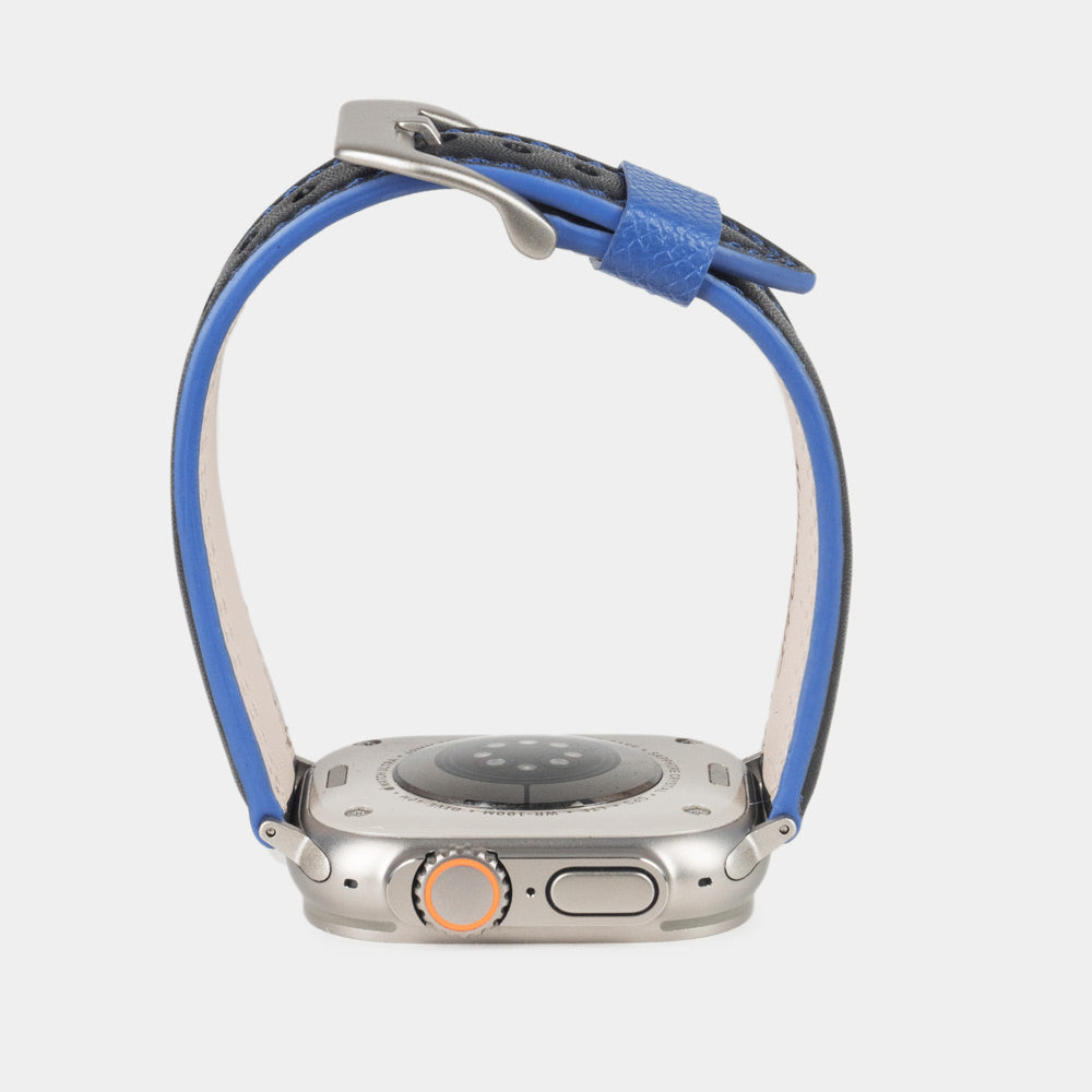 Men's Apple Watch Ultra band 49mm in black smooth calfskin leather with blue edge finish and its titanium color adapters - inside lining leather view