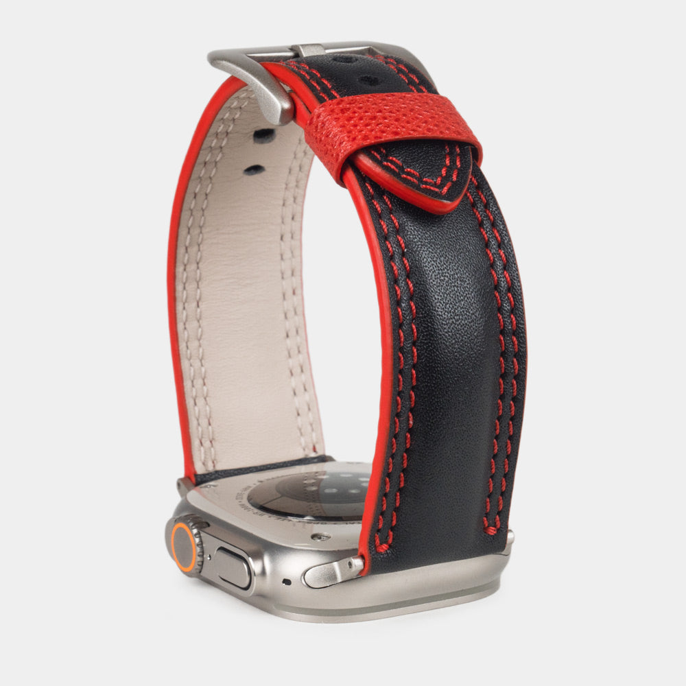 Men's Apple Watch Ultra band 49mm in black smooth calfskin leather with red edge finish and its titanium color adapters - inside lining leather view