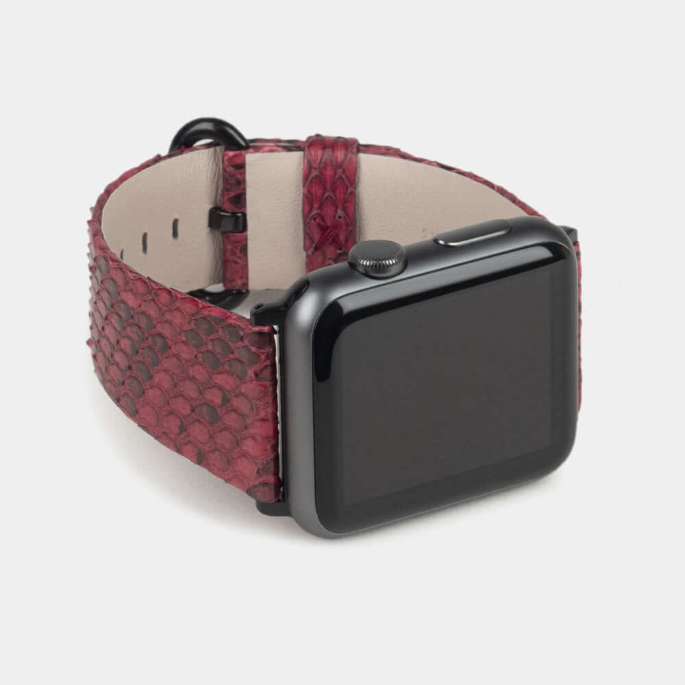 Strap for the Apple Watch 41/42 mm in bordeaux python leather, with black adapters and buckle | 3/4 profile view to see the inner lining leather