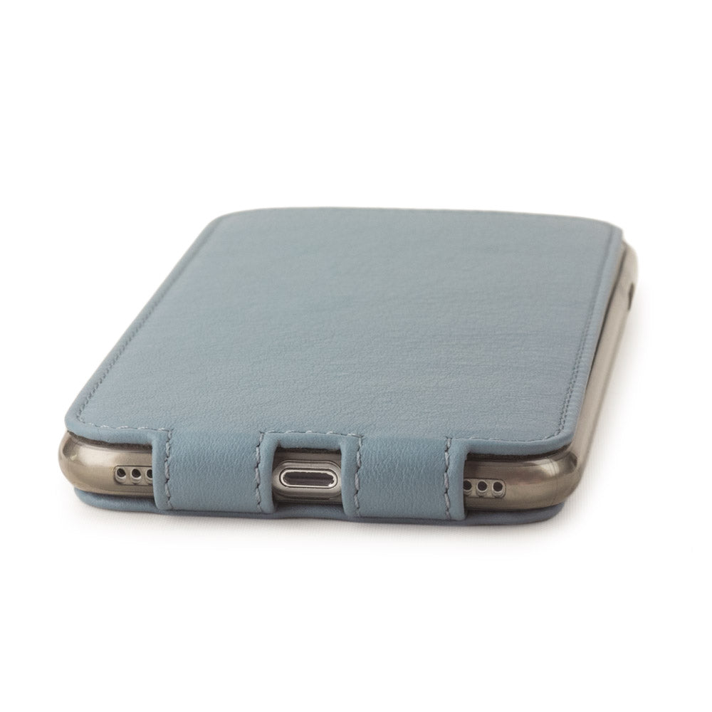 Blue Grey leather flip case for iPhone SE - flat side view displaying ultra-thin handcrafted design, Lightning port opening and precise edge finishing