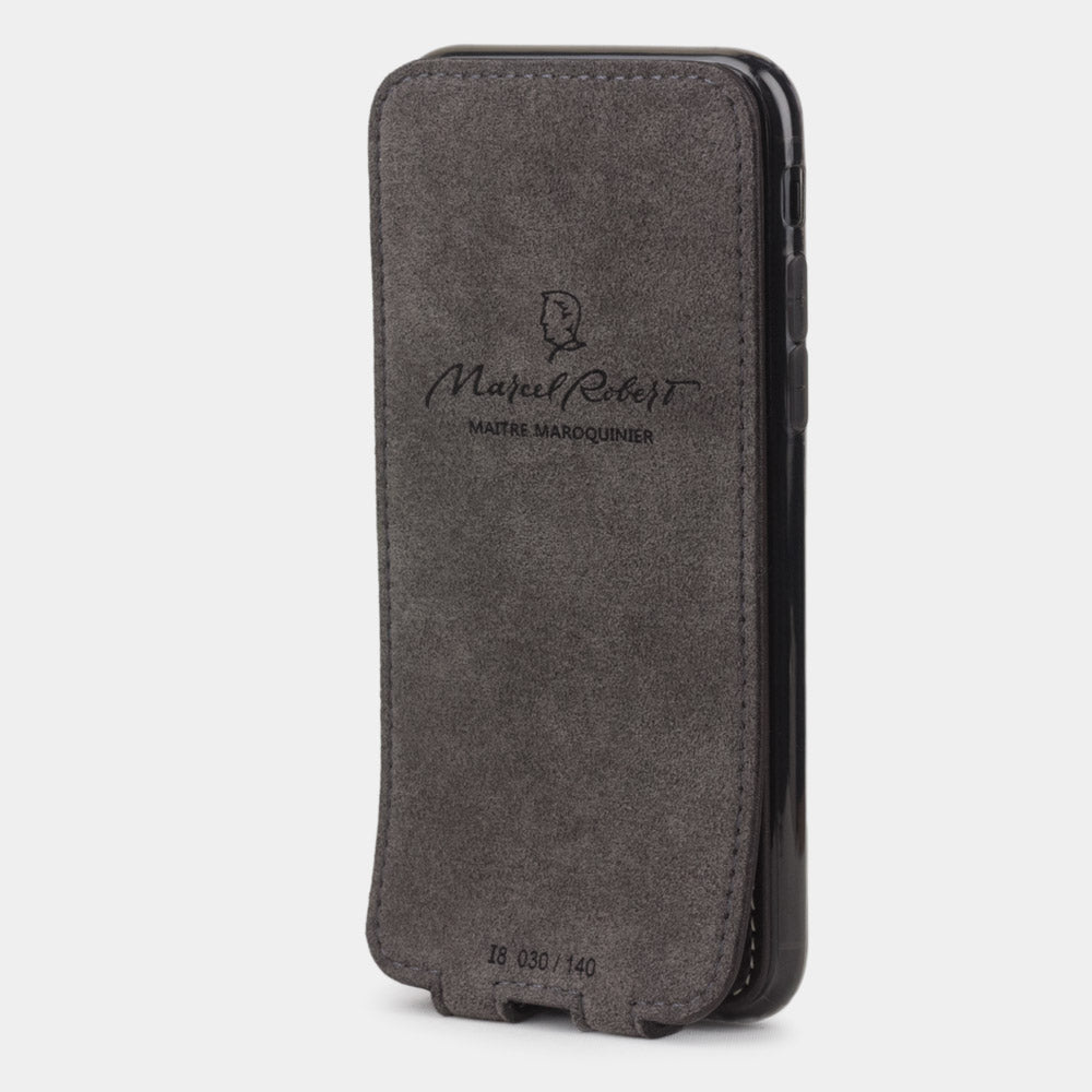 Brown leather flip case for iPhone SE - interior view showing grey Alcantara lining with magnetic closure, designed to clean and protect the screen