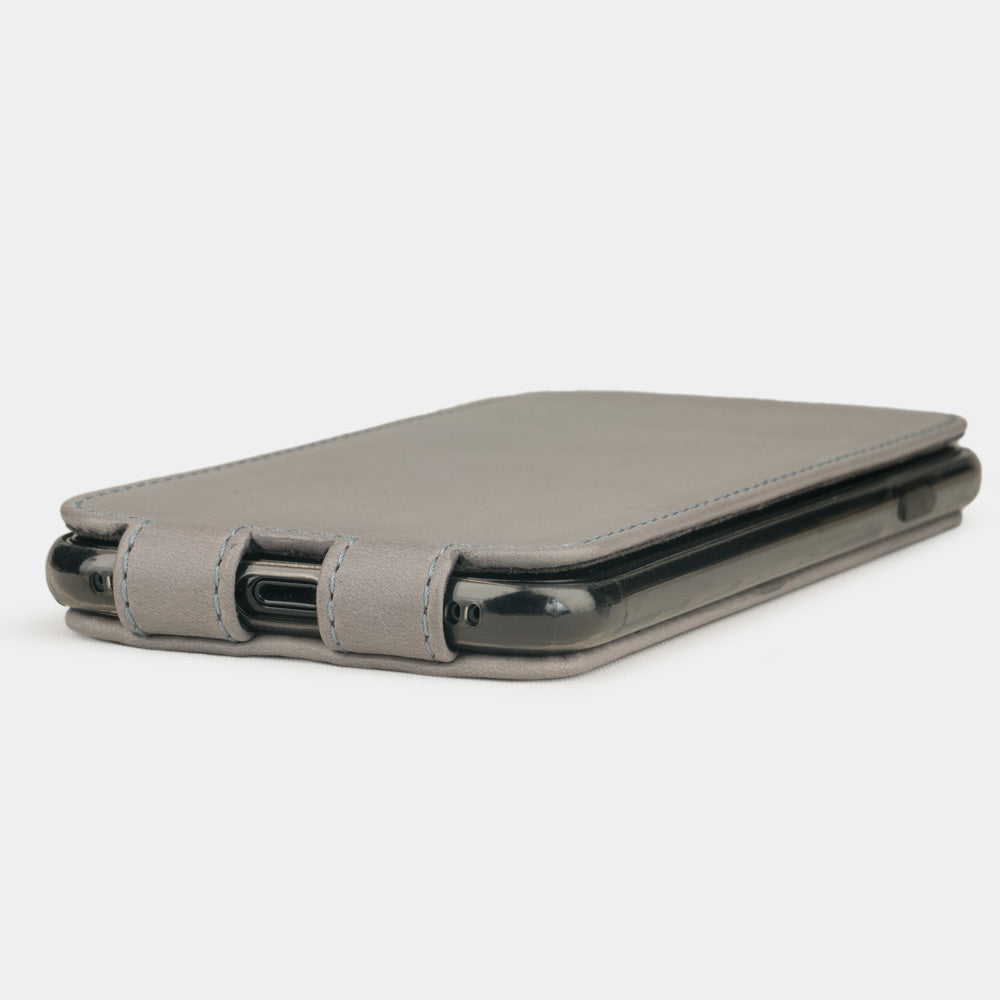 Grey Stone leather flip case for iPhone SE - flat side view displaying ultra-thin handcrafted design, Lightning port opening and precise edge finishing