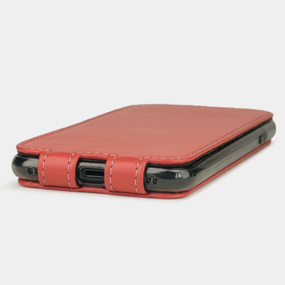 Red Coral leather flip case for iPhone SE - flat side view displaying ultra-thin handcrafted design, Lightning port opening and precise edge finishing