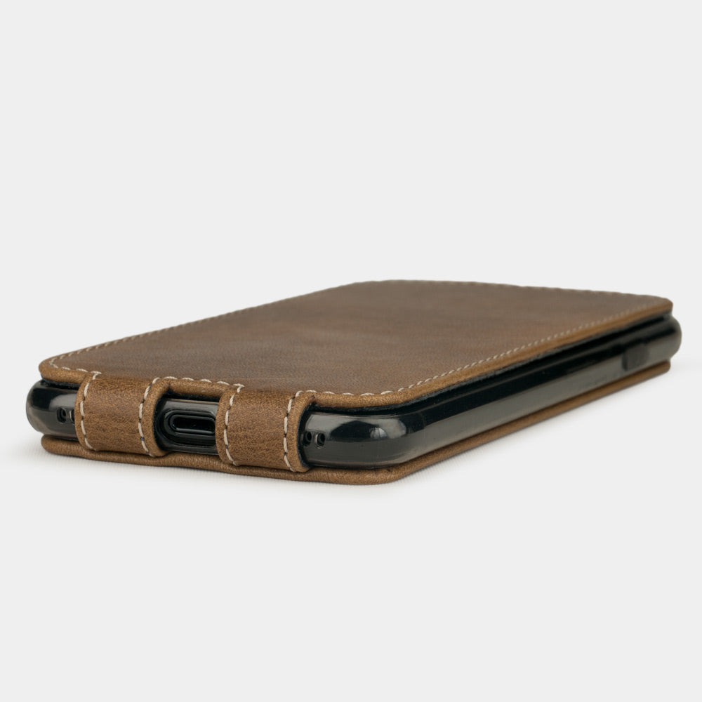 Vintage leather flip case for iPhone SE - flat side view displaying ultra-thin handcrafted design, Lightning port opening and precise edge finishing