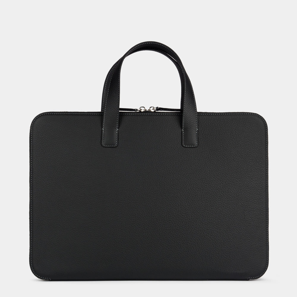 black men’s slim 17 inch leather laptop bag back view, clean exterior without pockets