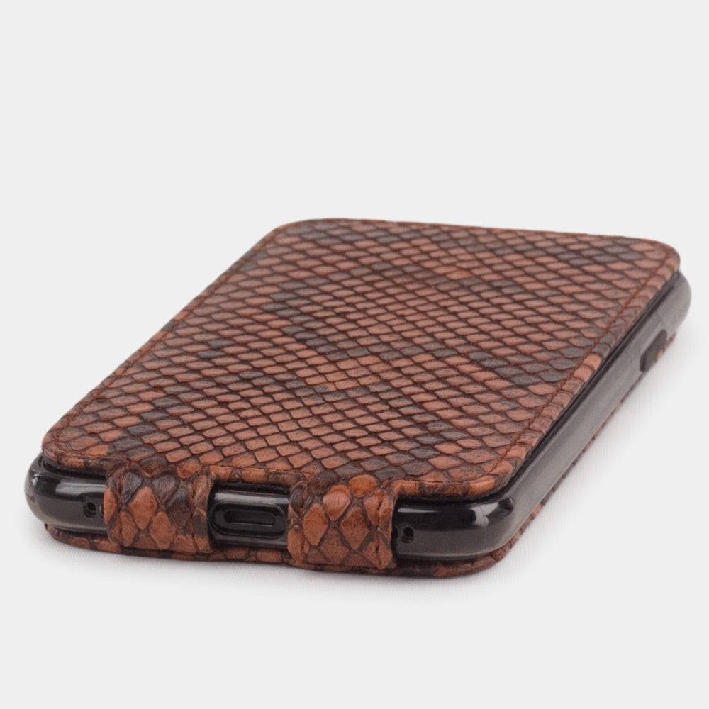 Gold python leather flip case for iPhone X - close-up of the bottom edge showing the Lightning port opening