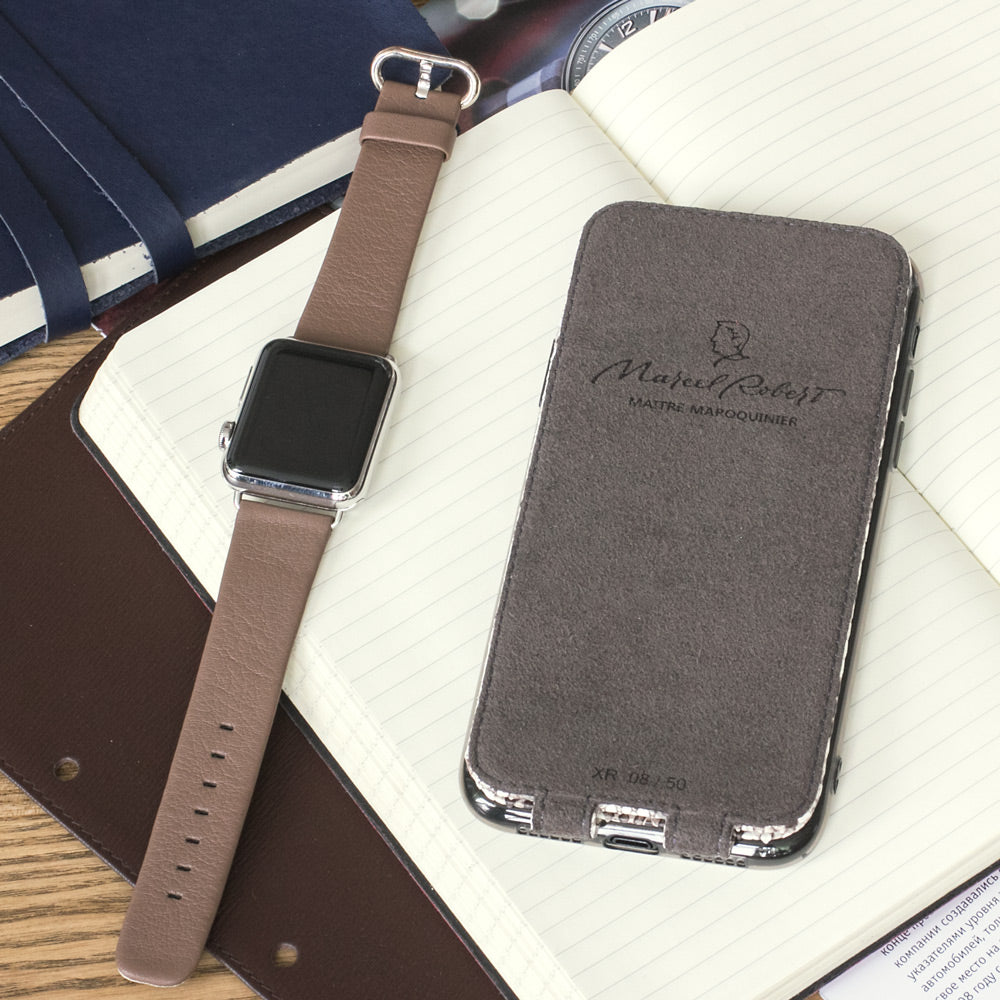 Natural python leather flip case for iPhone X - flat lay with matching Apple Watch strap and notebook