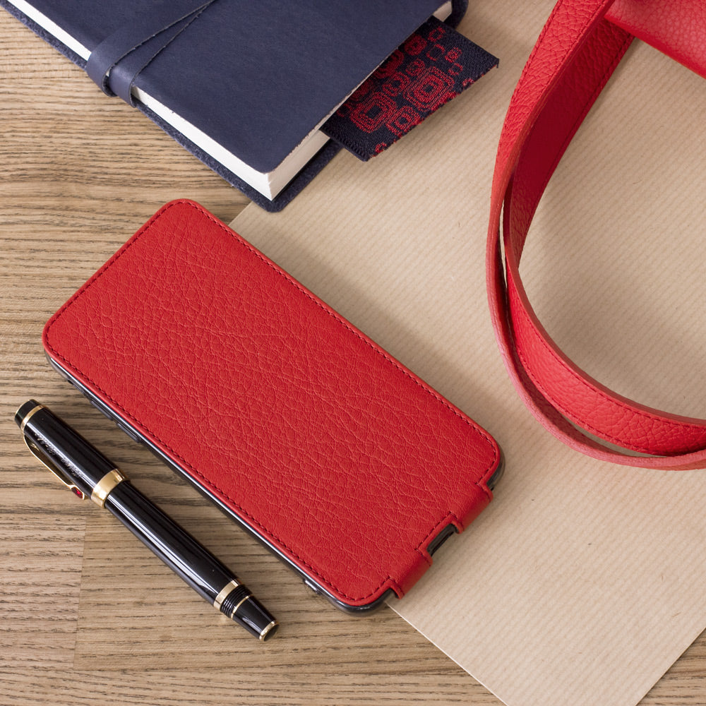 Red leather flip case for iPhone XS Max - flat lay with notebook and pen