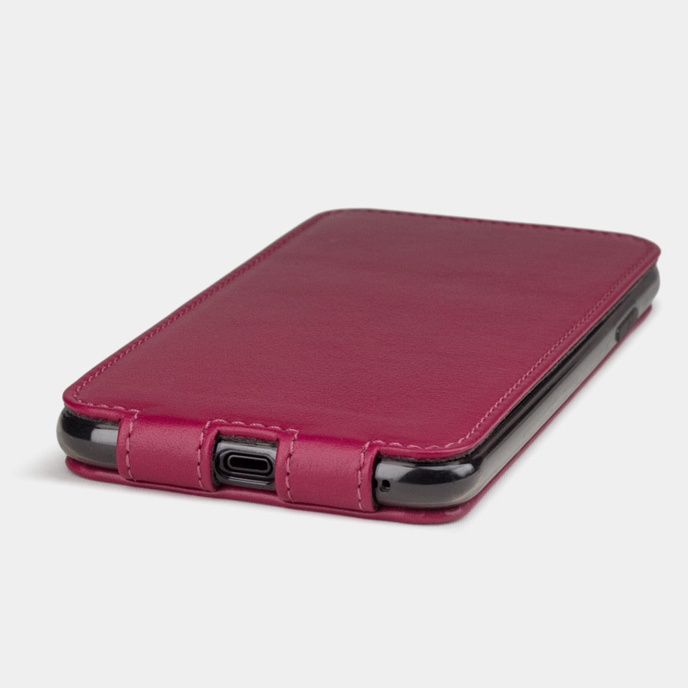 Fuchsia leather flip case for iPhone XS Max - close-up of the bottom edge showing the Lightning port opening