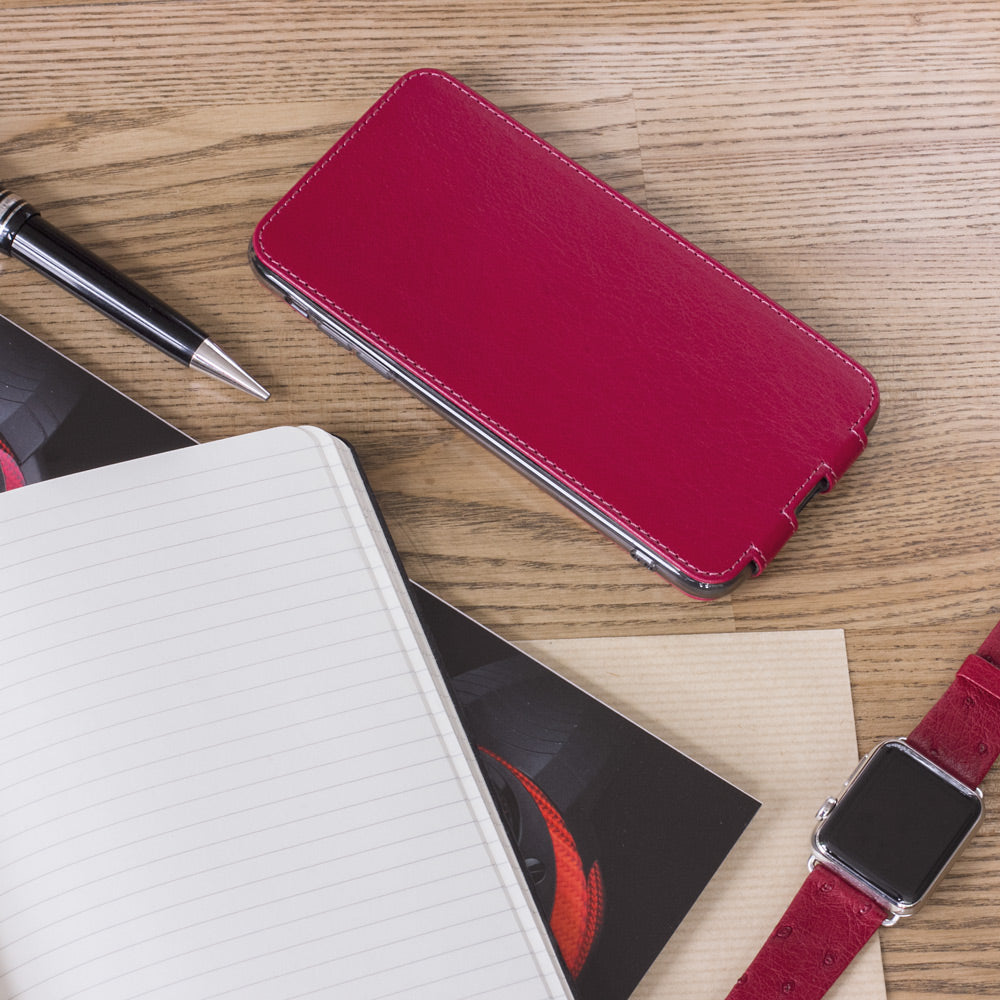Fuchsia leather flip case for iPhone XS Max - flat lay with notebook and pen