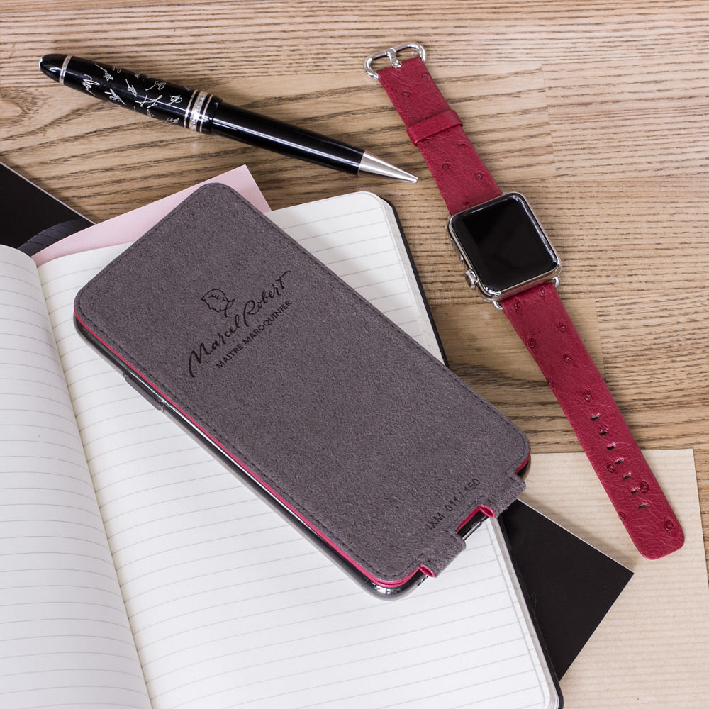Fuchsia leather flip case for iPhone XS Max - flat lay with matching Apple Watch strap and notebook