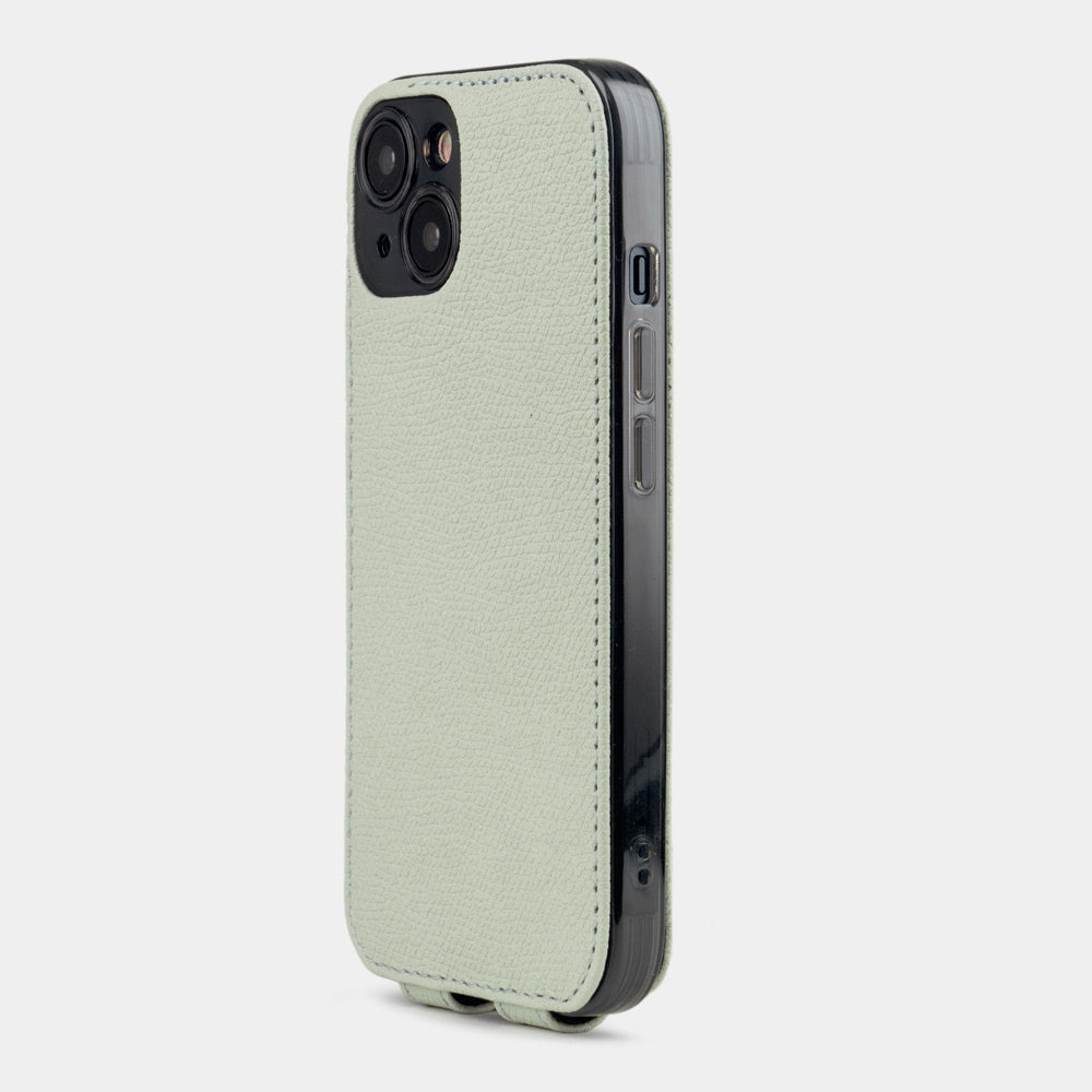 Pastel green calfskin leather flip case for iPhone 15 Plus – back view showing the camera cutout and hand-stitched edges