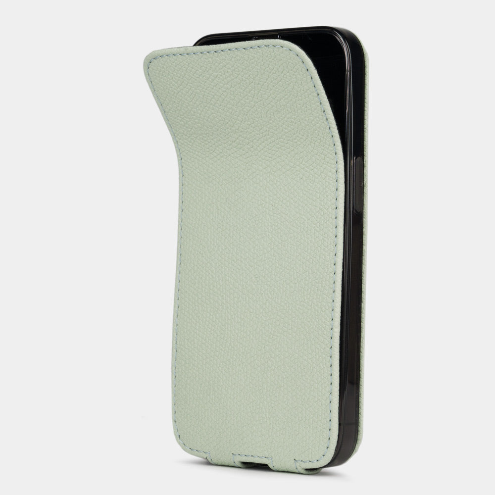 Pastel green calfskin leather flip case for iPhone 15 Plus – magnetic flap opening to reveal the screen