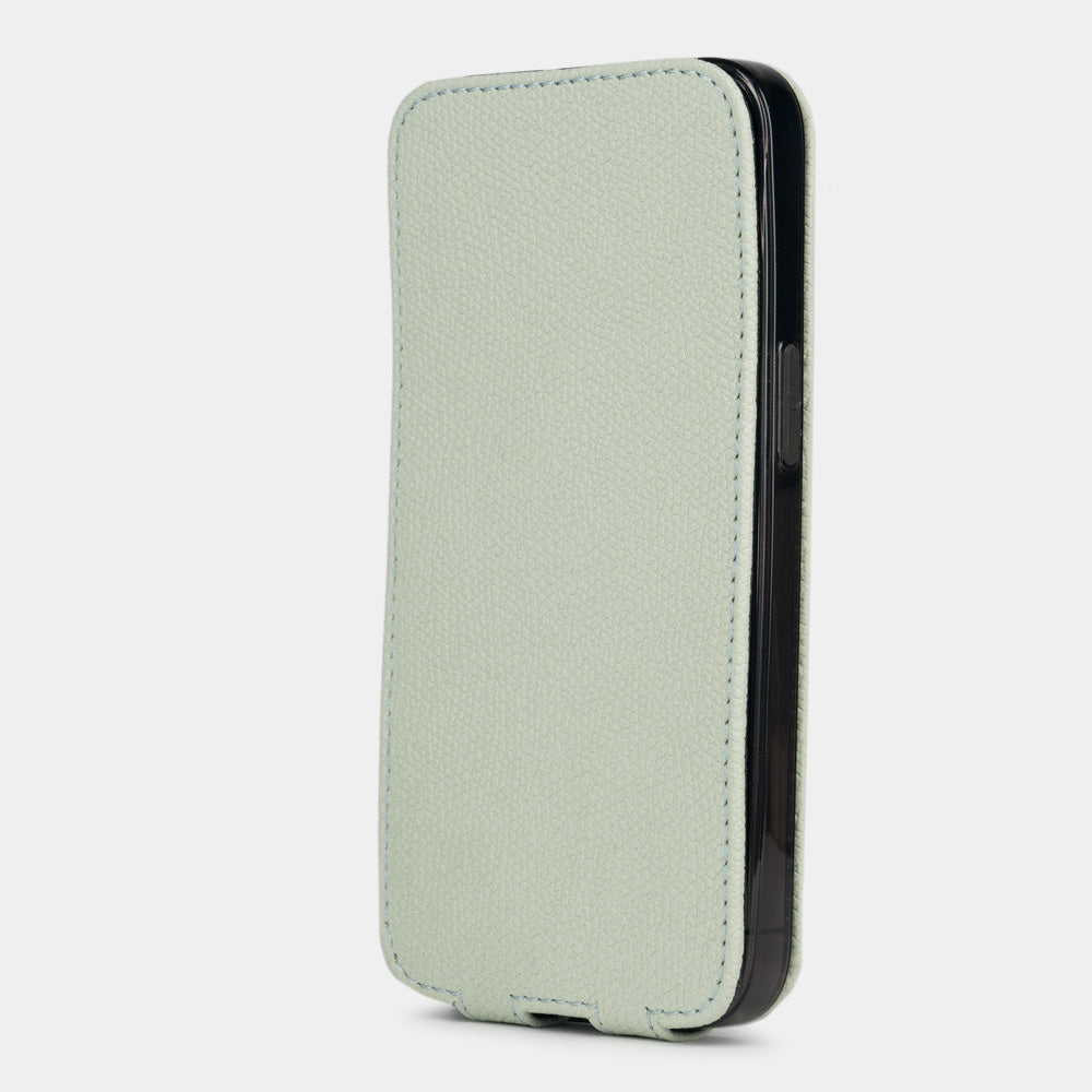 Pastel green calfskin leather flip case for iPhone 15 Plus – flap closed flat, profile view with side buttons accessible