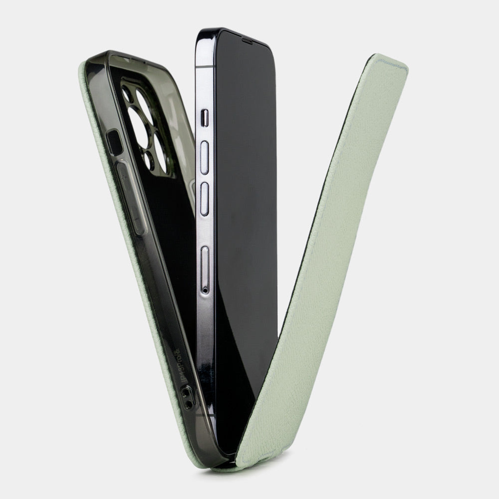 Pastel green calfskin leather flip case for iPhone 15 Plus – case shown apart from the phone, how to install the phone into the slim shell and camera cutout visible