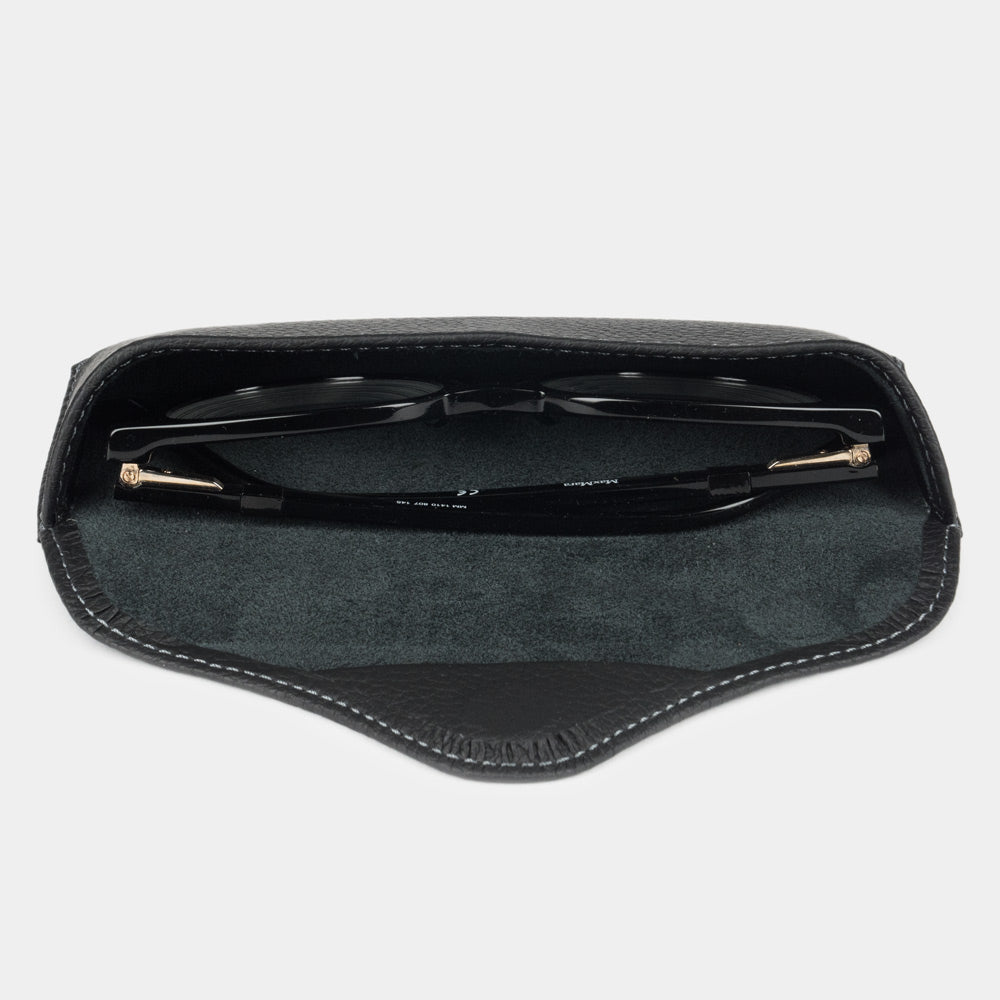 Black calfskin Casual case seen from above, glasses resting on the suede