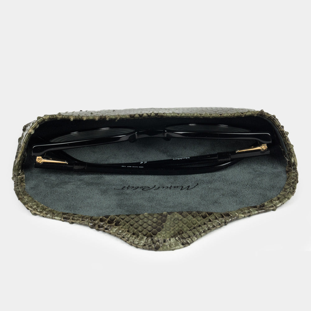 Green python leather Casual case seen from above, glasses resting on the suede
