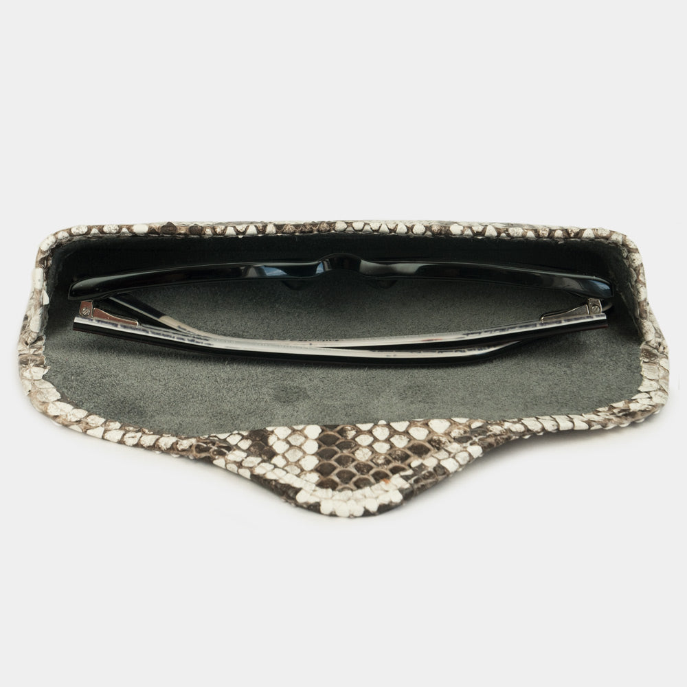 Natural python leather Casual case seen from above, glasses resting on the suede