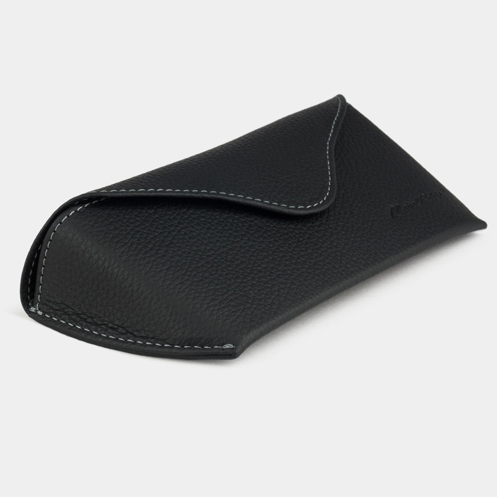 Black calfskin Riviera sunglasses case at an angle, curved magnetic flap