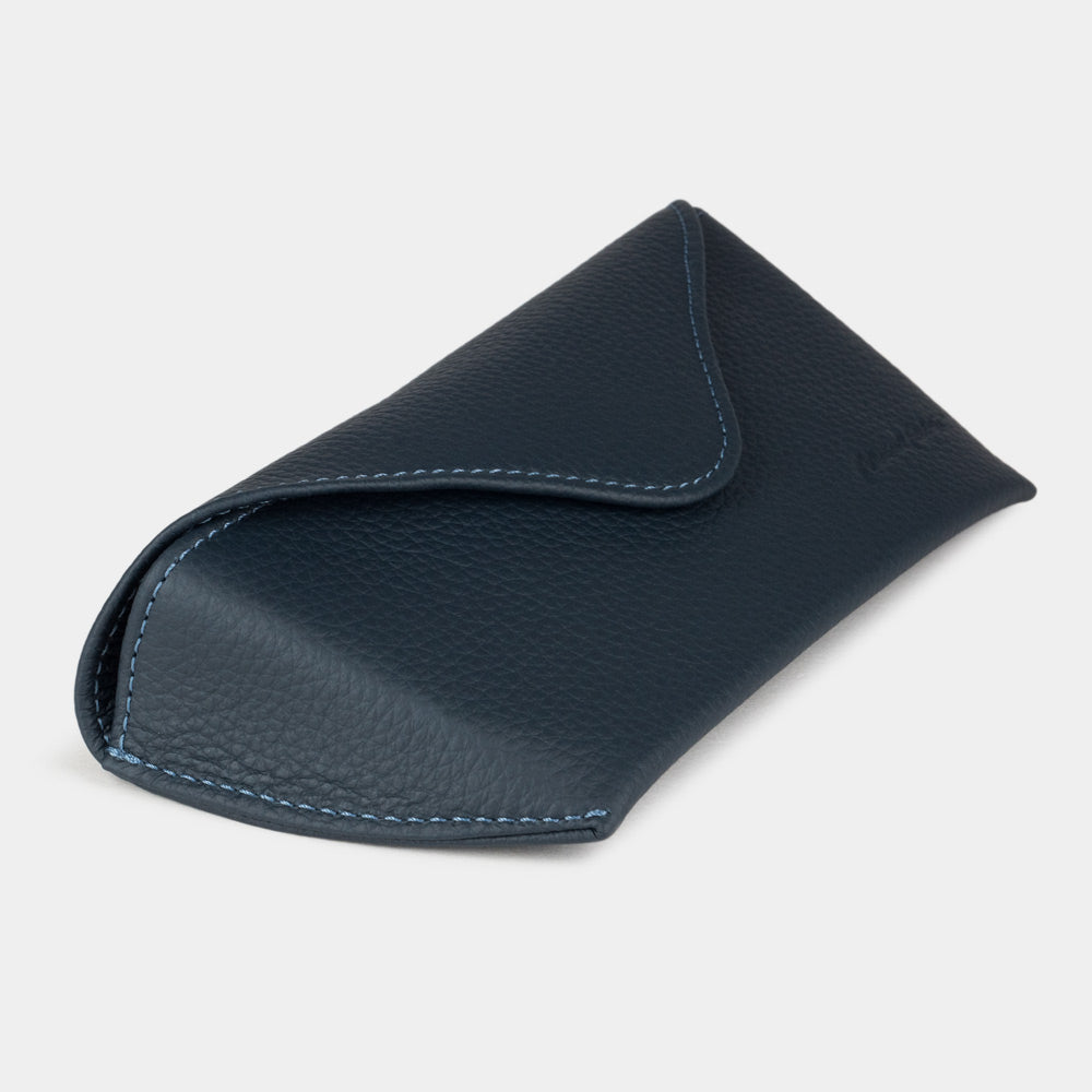 Blue calfskin Riviera sunglasses case at an angle, curved magnetic flap