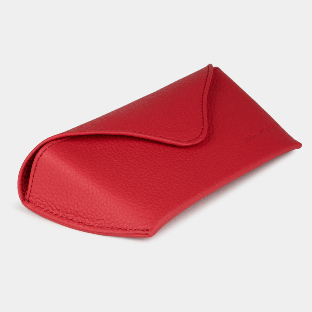Red calfskin Riviera sunglasses case at an angle, curved magnetic flap