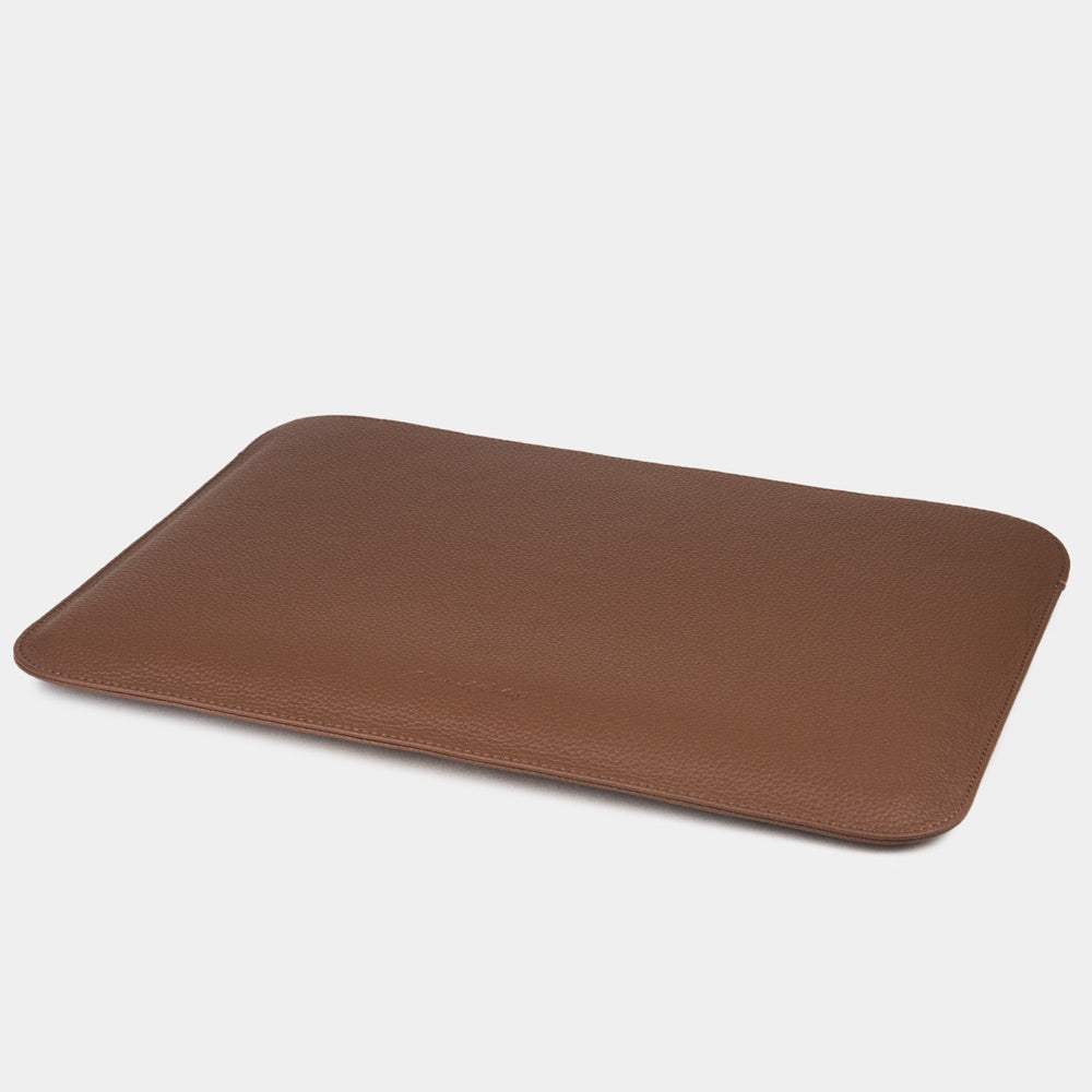 Leather laptop sleeve for MacBook Air 15 inch, brown – the empty sleeve laid flat, showing how slim it stays