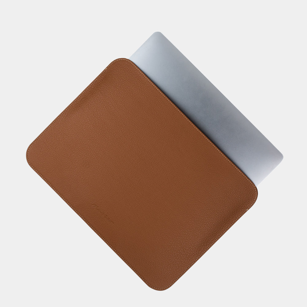 14 inch leather laptop sleeve gold with MacBook partially inserted, slim minimalist leather laptop pouch