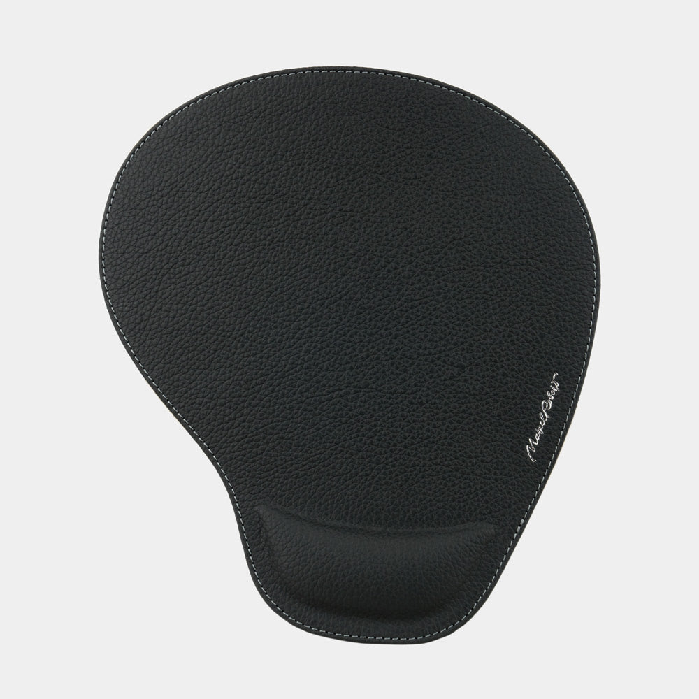 Black leather mouse pad seen from above, teardrop shape and embossed signature