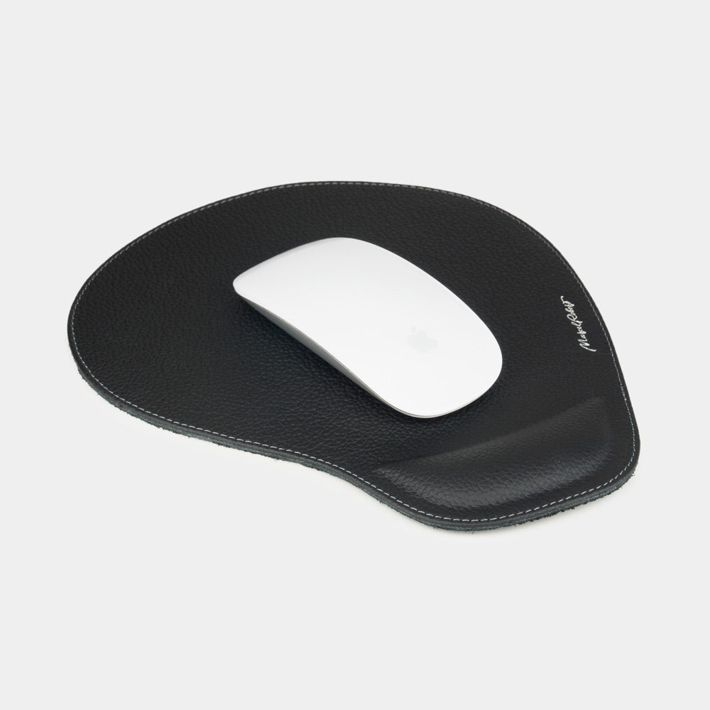 Black leather mouse pad with wrist rest, white mouse on grained calfskin