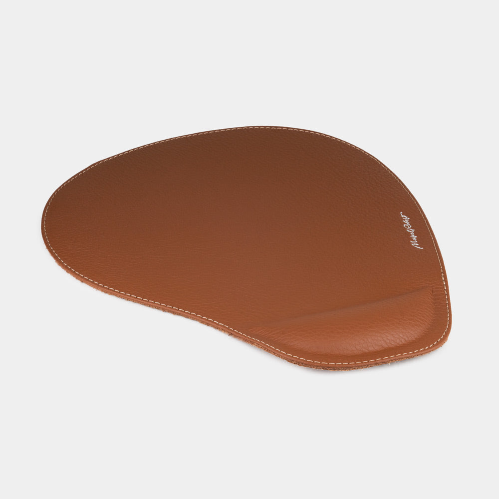 Gold leather mouse pad, side view of the padded wrist rest and stitched edge
