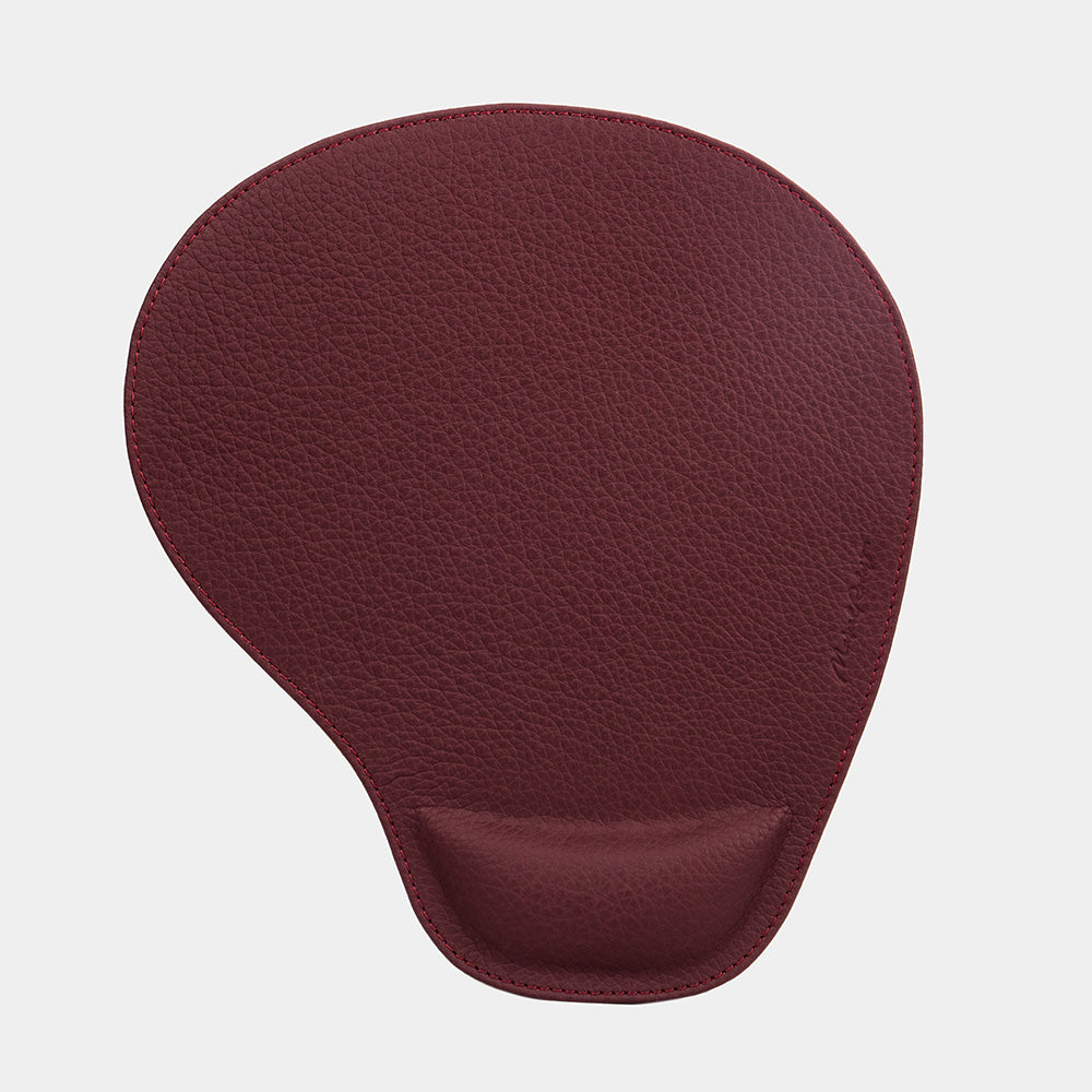 Bordeaux leather mouse pad seen from above, teardrop shape and embossed signature