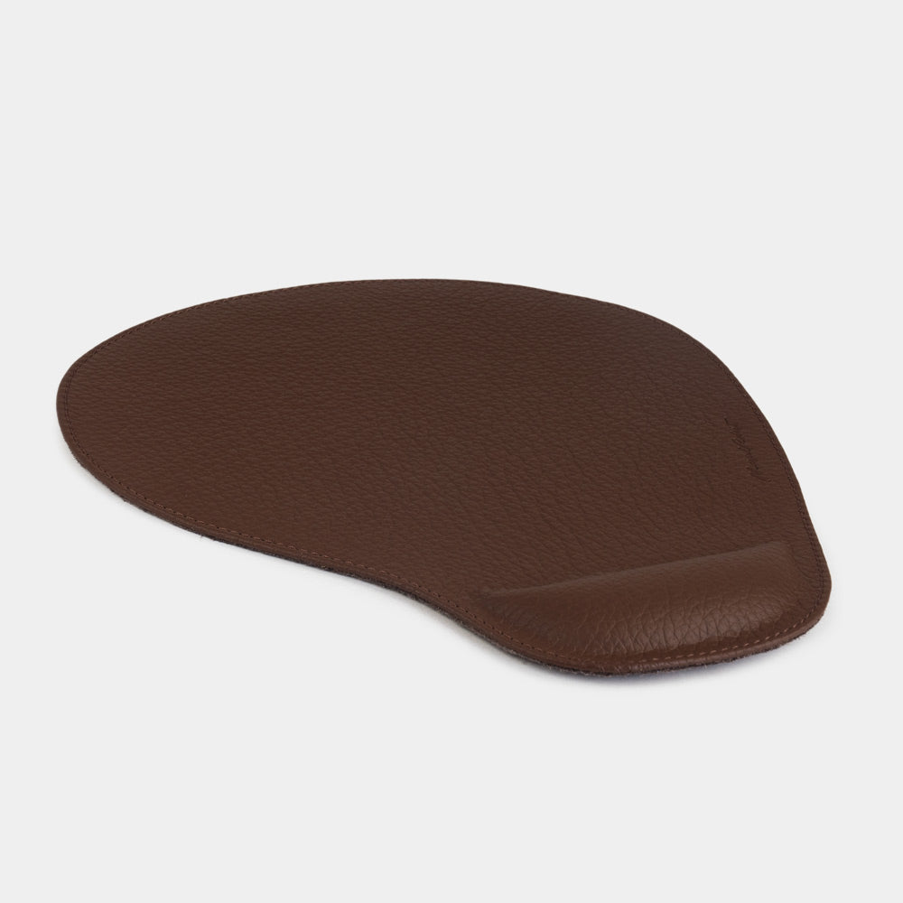 Brown leather mouse pad, side view of the padded wrist rest and stitched edge